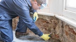 Inserting Dryrods into the wall to form a damp-proof course